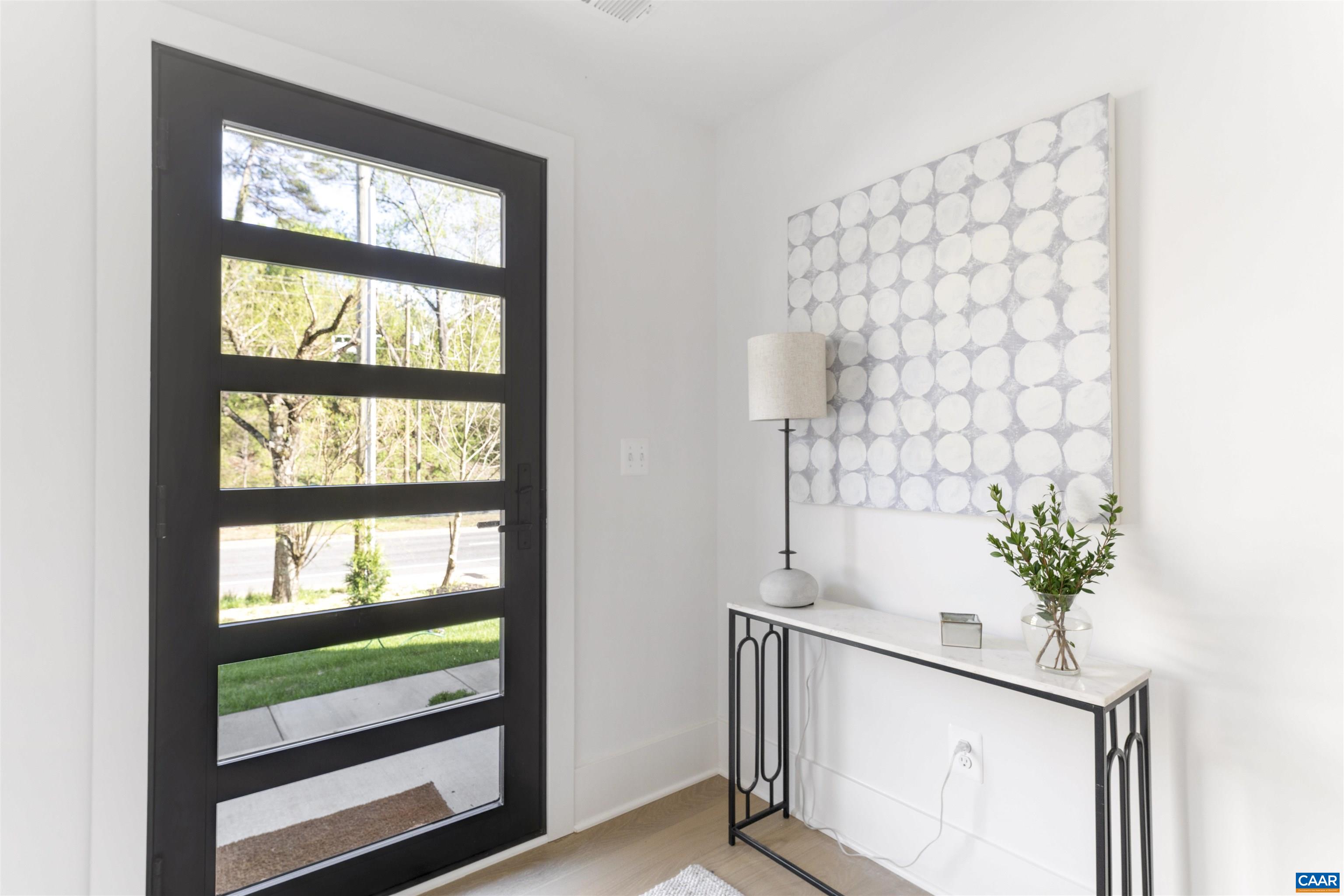 987 5th Street Southwest Charlottesville, VA 22903 - Photo 5 of 33 a view of entryway with a window and a potted plant