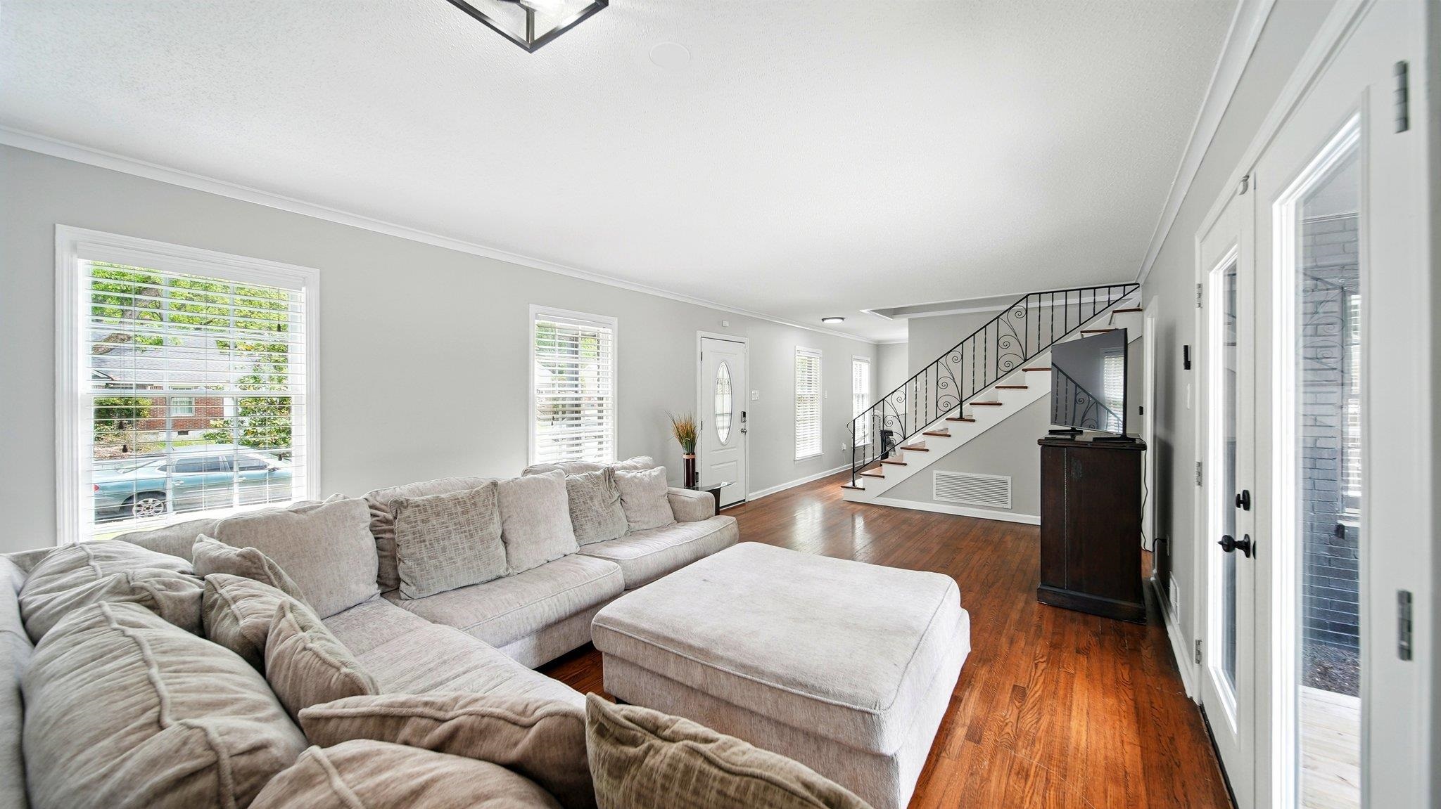 359 South Fenwick Road Memphis, TN 38111 - Photo 6 of 31 Living room featuring ornamental molding and dark wood finished floors