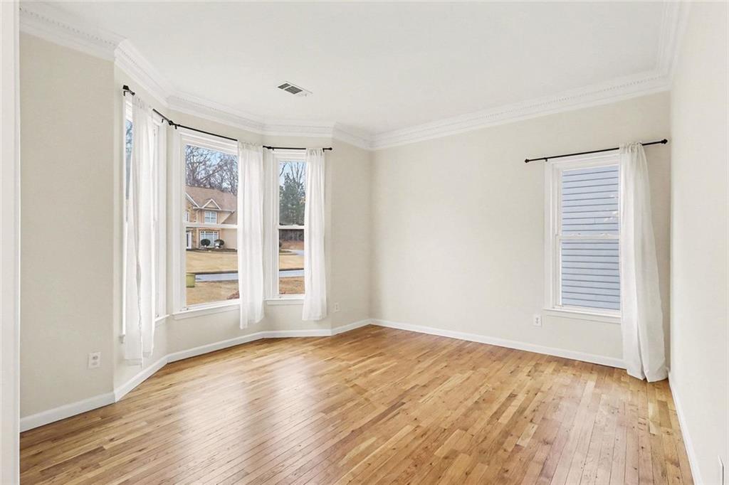 3124 Sherwood Oaks Lane Decatur, GA 30034 - Photo 11 of 41 a view of an empty room with a window and wooden floor