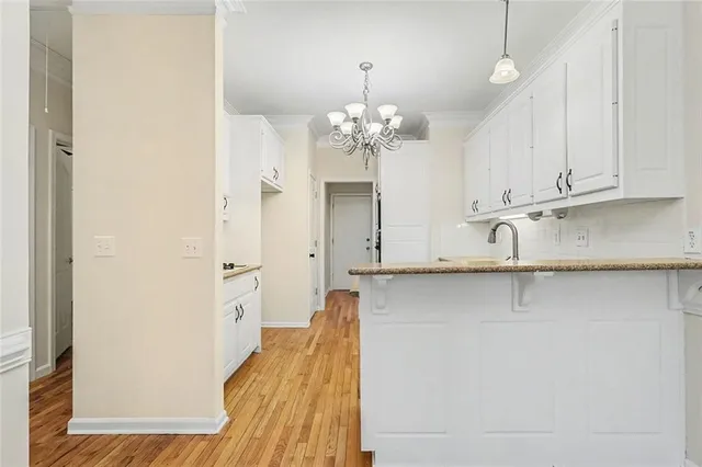 a view of a kitchen with a sink and dishwasher