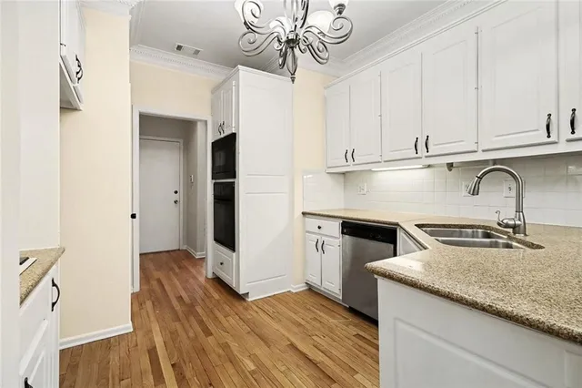 a kitchen with sink cabinets and window