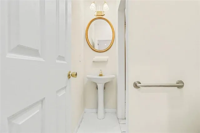a bathroom with a sink a mirror and a shower
