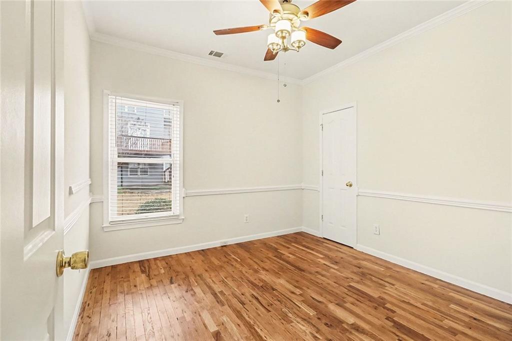 3124 Sherwood Oaks Lane Decatur, GA 30034 - Photo 27 of 41 an empty room with a window and chandelier fan