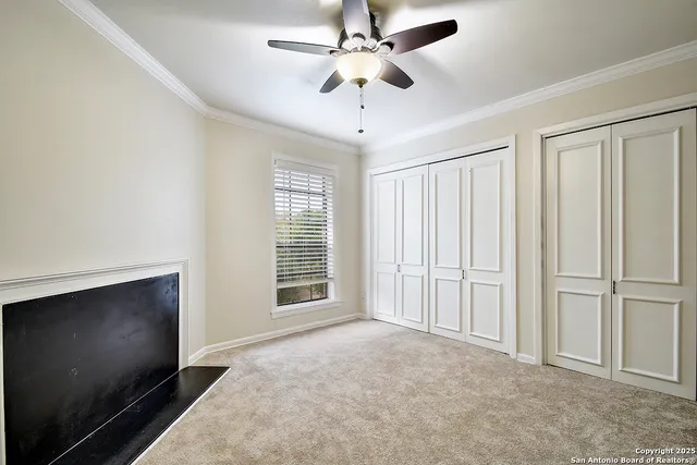 en empty room with windows and fan