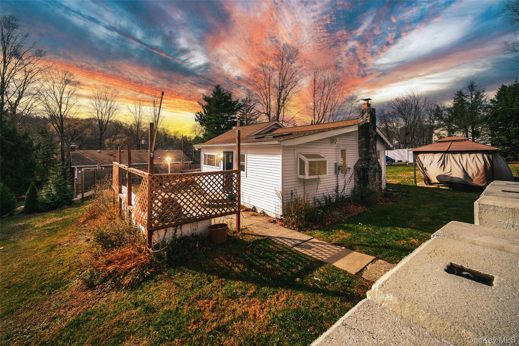 a view of a patio with a table and chairs