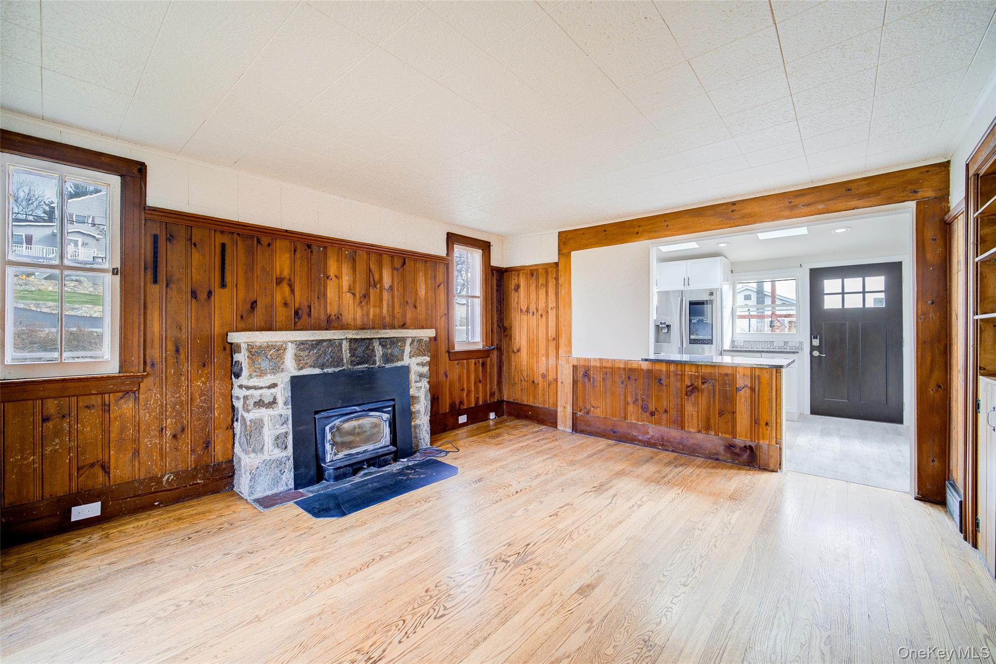 17 Baldwin Road Carmel, NY 10512 - Photo 5 of 29 a living room with a fireplace and a wooden floor