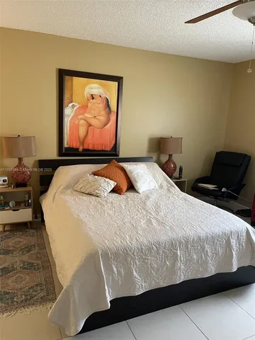 a bathroom with double vanity sinks and a mirror