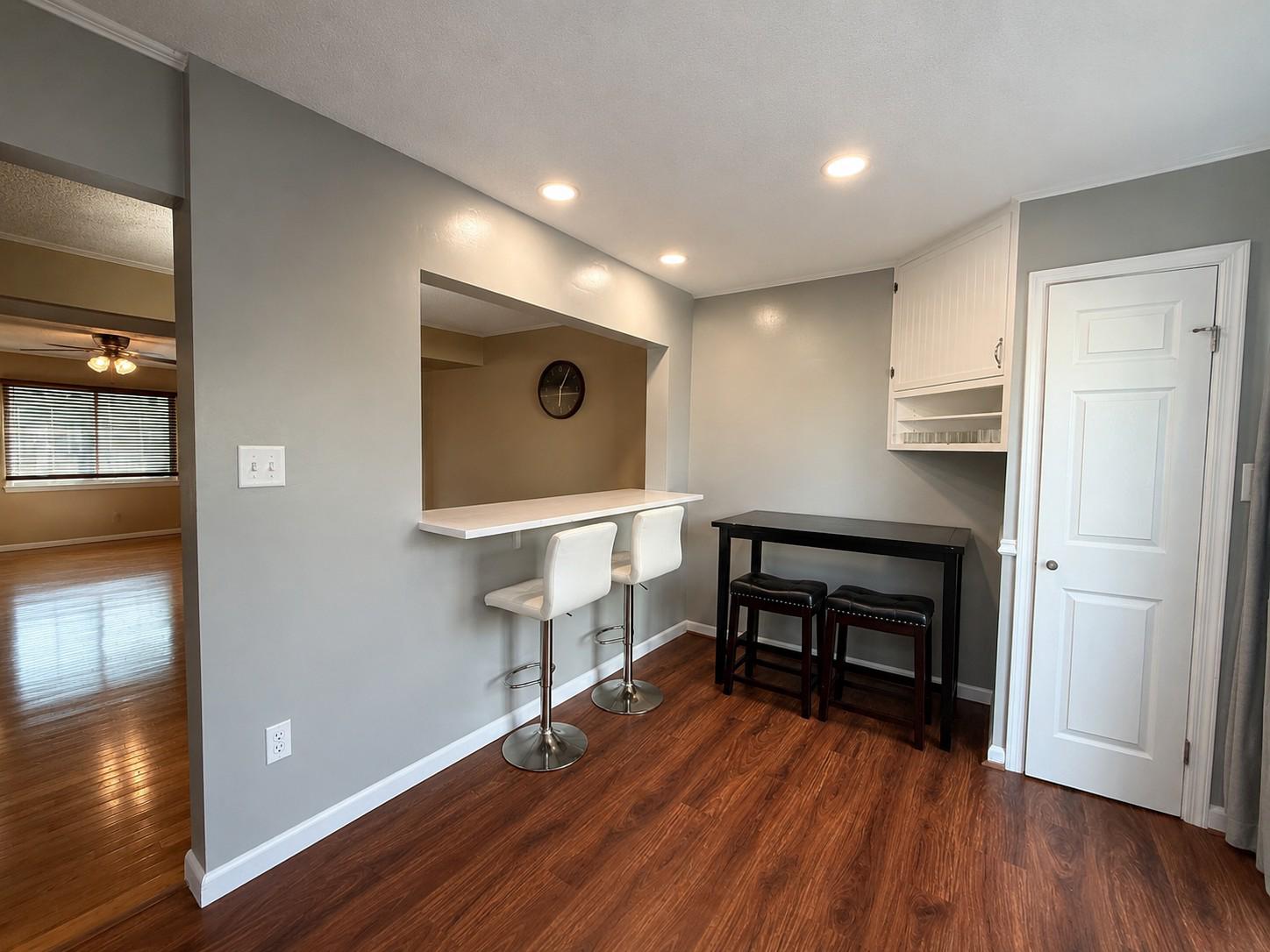 813 Thimbleberry Road, Unit 813 Baltimore, MD 21220 - Photo 8 of 32 Kitchen renovated (2025) w/ nook and bar seats.