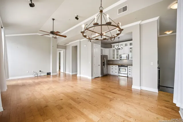a view of a livingroom with a kitchen and a window