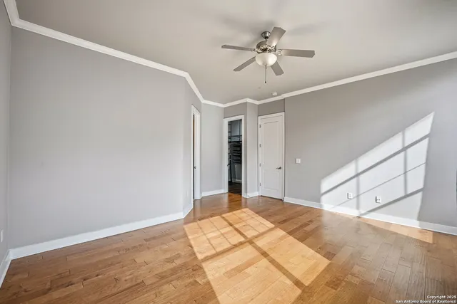 a view of a room with wooden floor