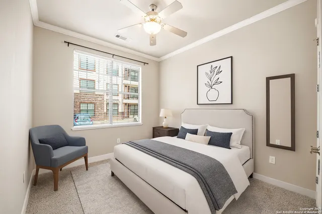 a bedroom with bed and a couch