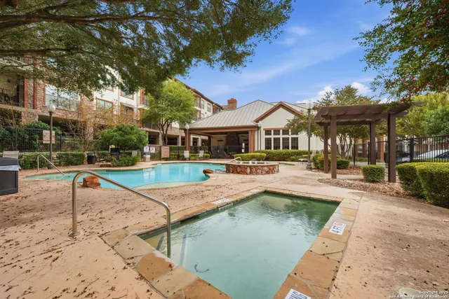 a view of a house with swimming pool and a yard