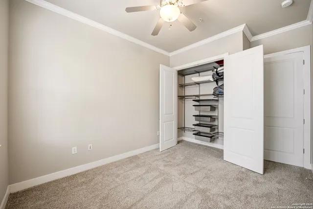 a view of an empty room with a cabinet