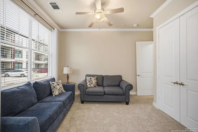 a living room with furniture and a window