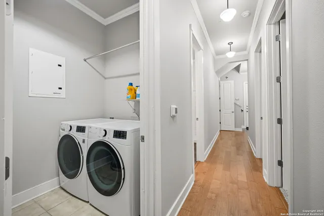 a view of a hallway with washer and dryer