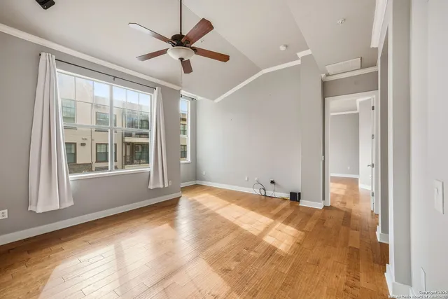 a view of an empty room with a window