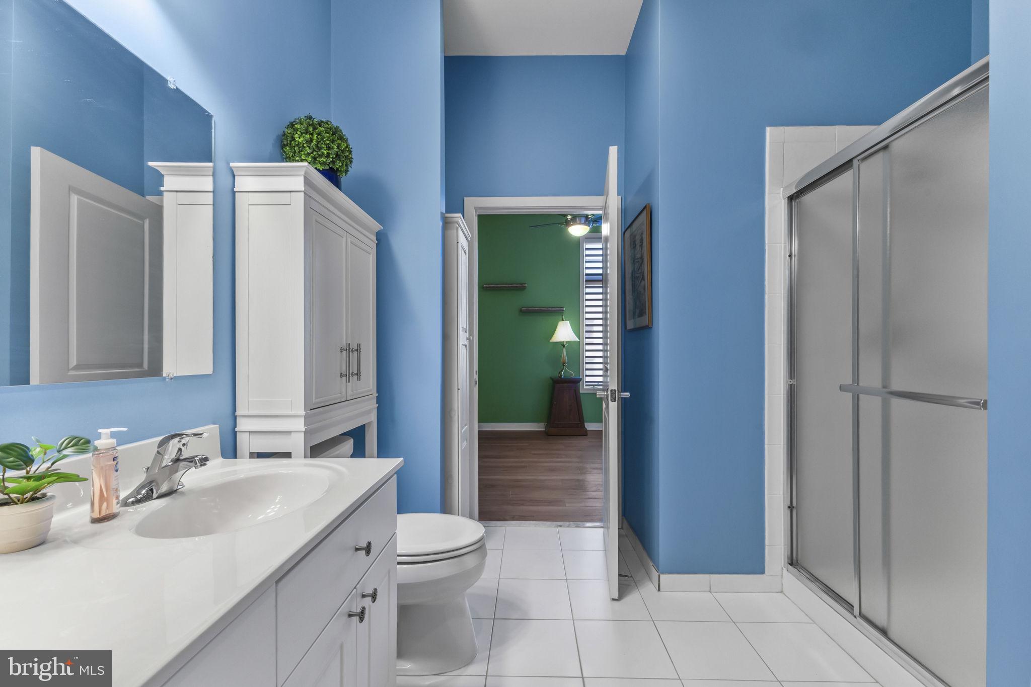 181 East Reed Avenue, Unit 411 Alexandria, VA 22305 - Photo 21 of 24 a bathroom with a sink a toilet and shower