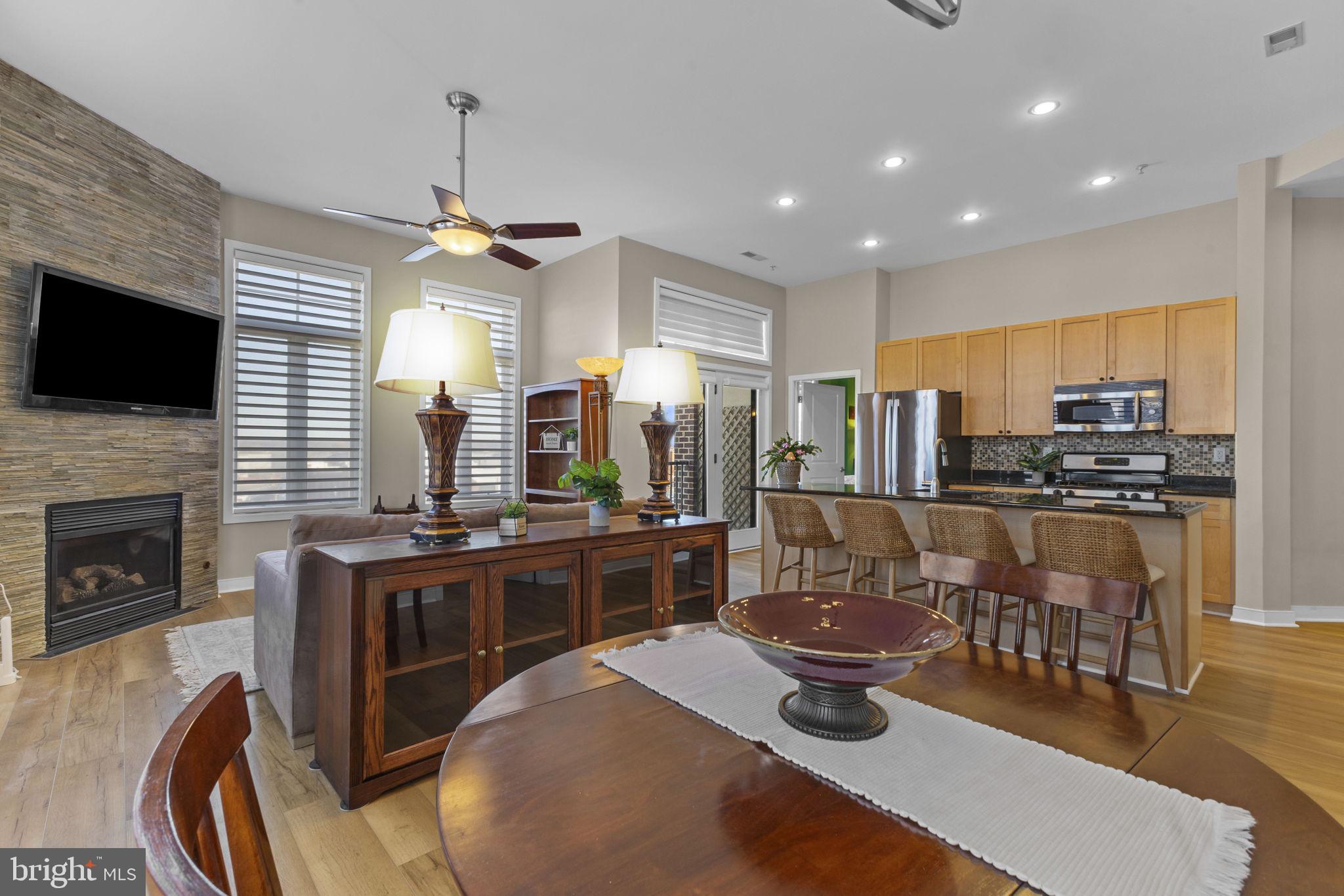 181 East Reed Avenue, Unit 411 Alexandria, VA 22305 - Photo 8 of 24 a kitchen with sink stove top oven and microwave
