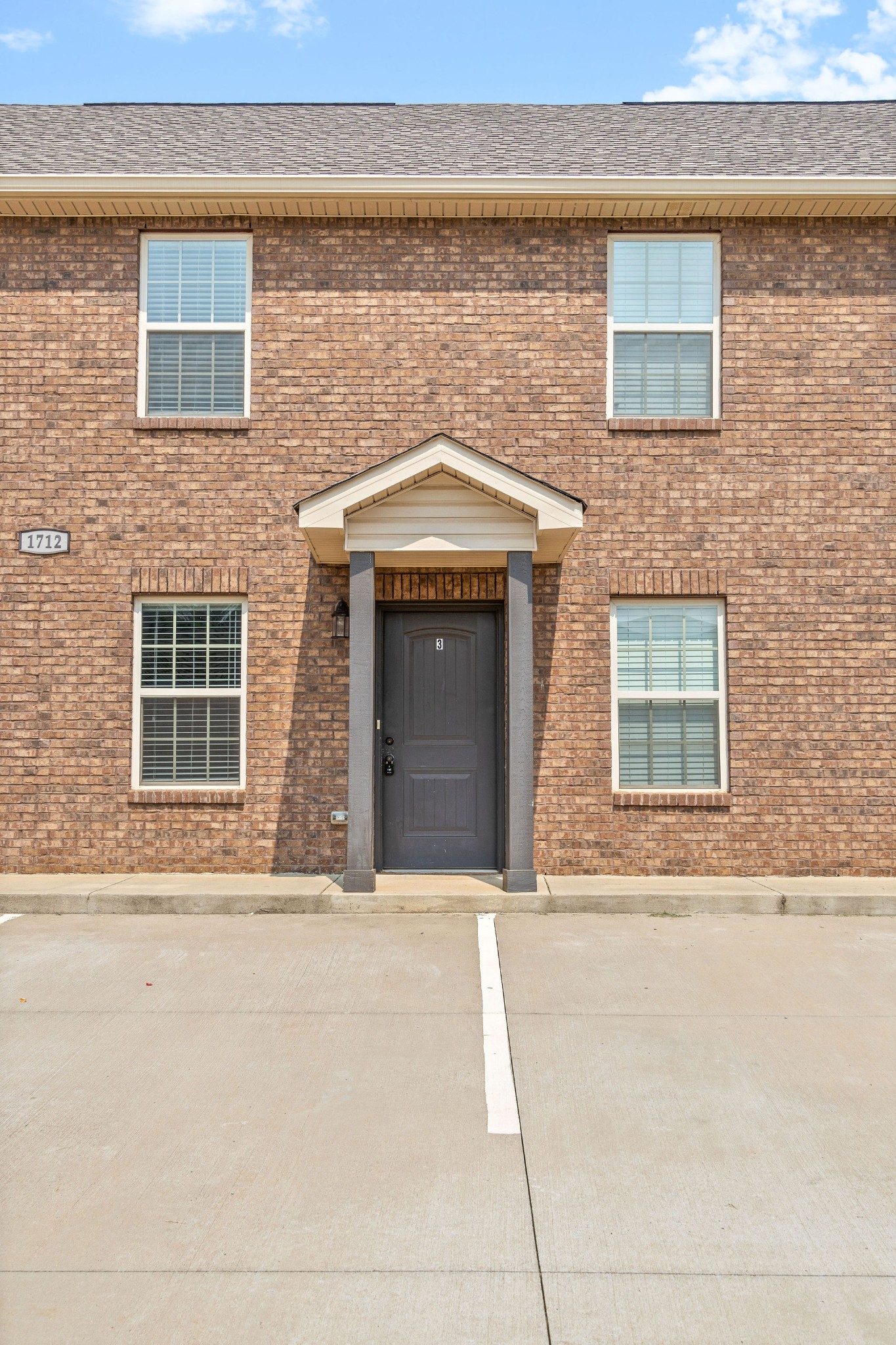 1712 Manning Drive, Unit 3 Clarksville, TN 37042 - Photo 1 of 20 a front view of a building with an outdoor space