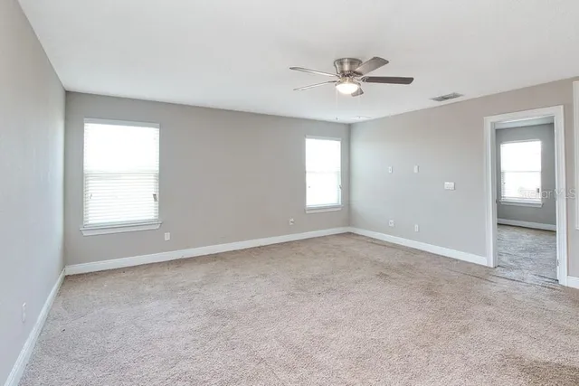 a view of an empty room with a window