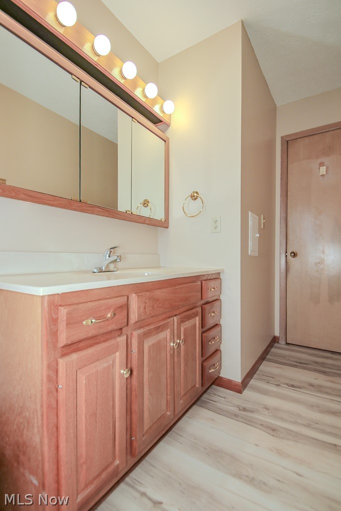 30224 Regent Road Wickliffe, OH 44092 - Photo 12 of 27 Bathroom featuring vanity and light wood finished floors