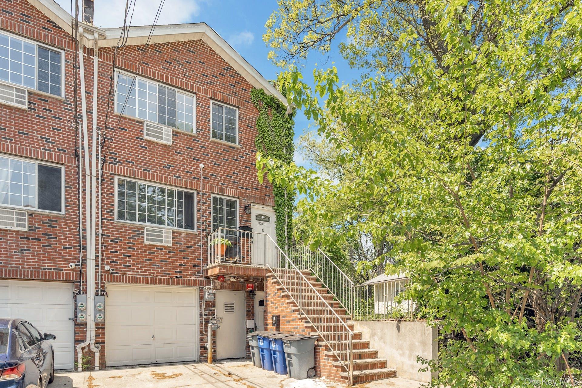 3313 Rombouts Avenue Bronx, NY 10475 - Photo 2 of 44 a front view of a house with a tree