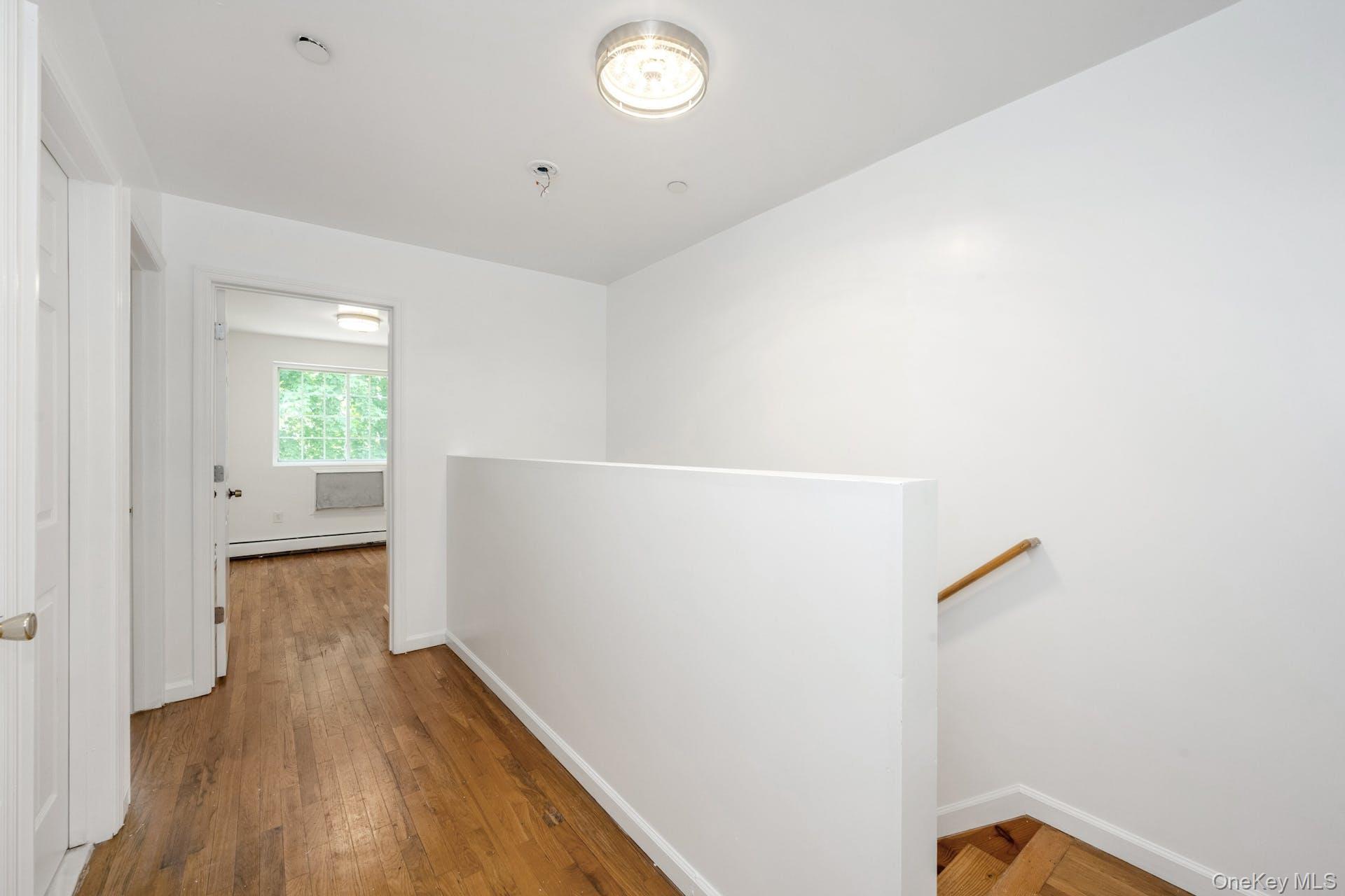 3313 Rombouts Avenue Bronx, NY 10475 - Photo 24 of 44 a view of hallway with wooden floor