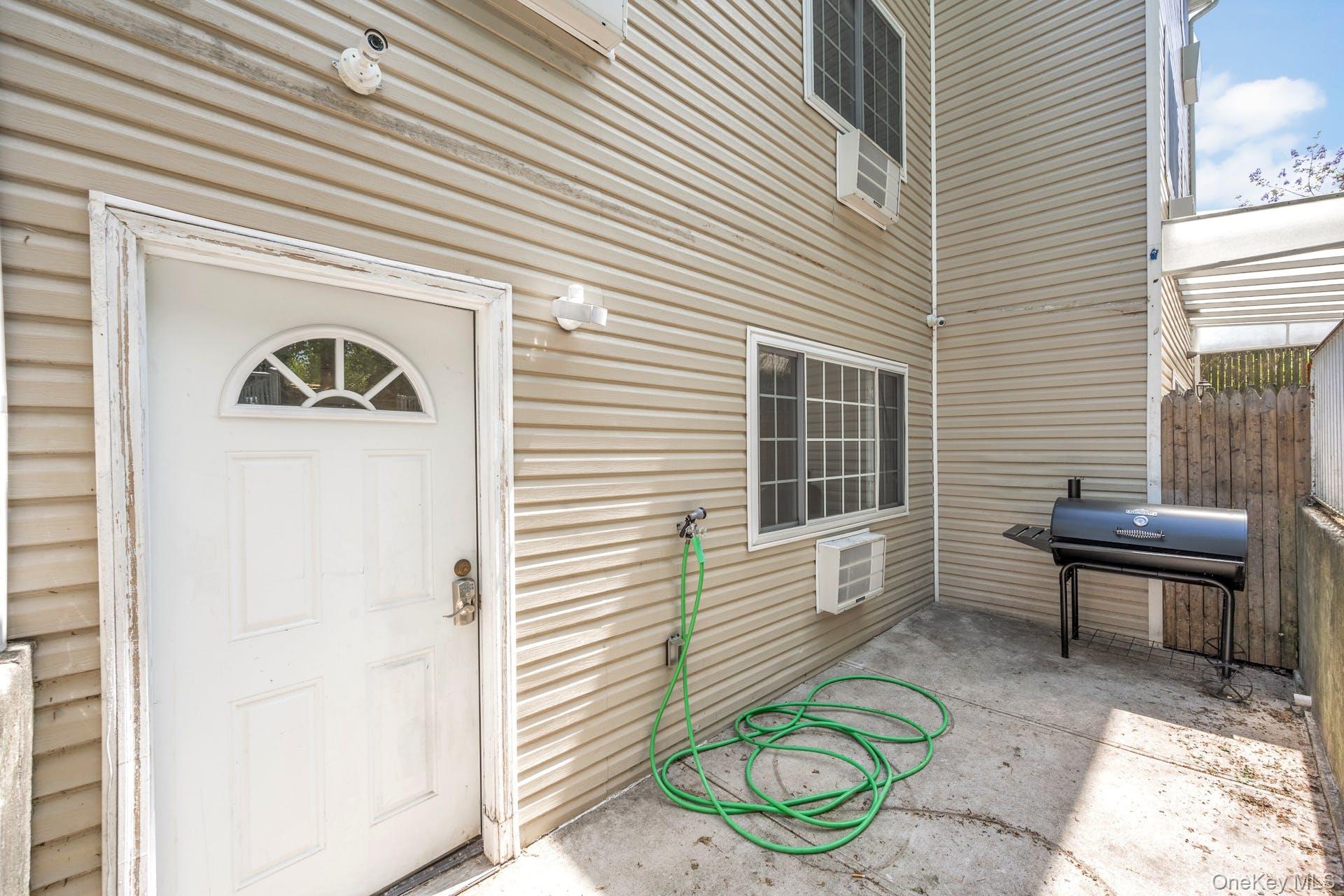 3313 Rombouts Avenue Bronx, NY 10475 - Photo 27 of 44 a front view of a house with a garden