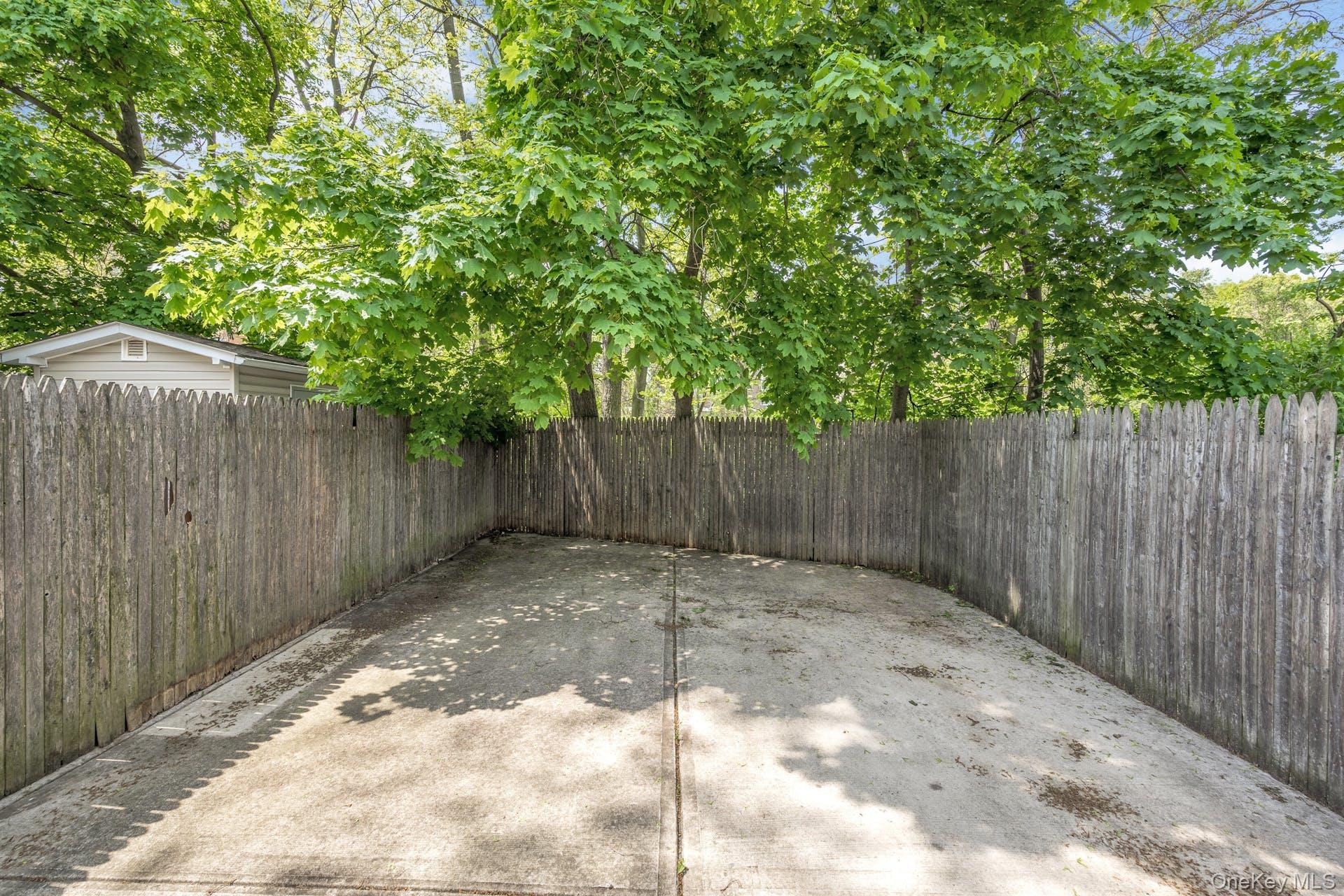 3313 Rombouts Avenue Bronx, NY 10475 - Photo 30 of 44 a backyard of a house with green landscape