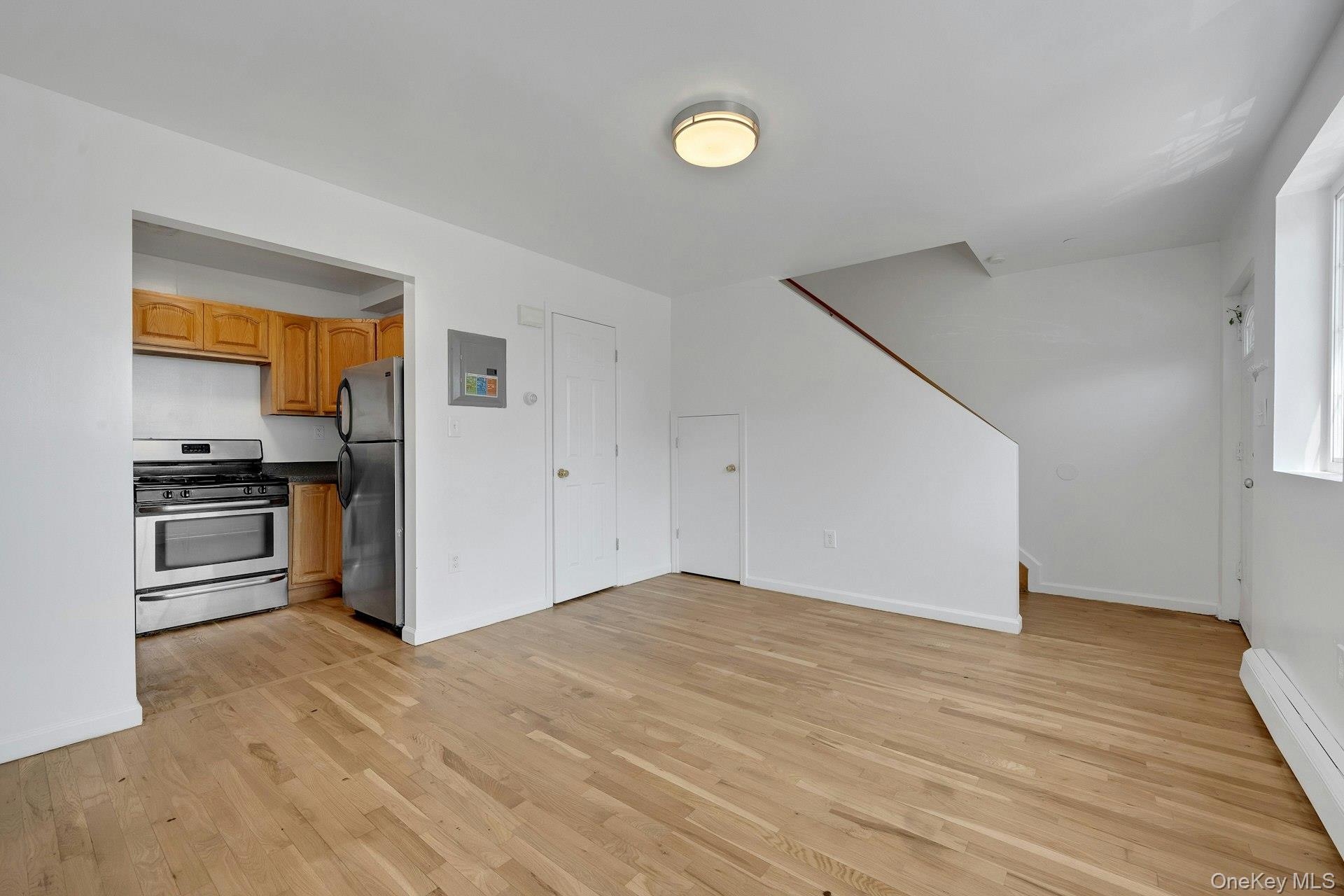 3313 Rombouts Avenue Bronx, NY 10475 - Photo 34 of 44 a view of kitchen with wooden floor electronic appliances and window