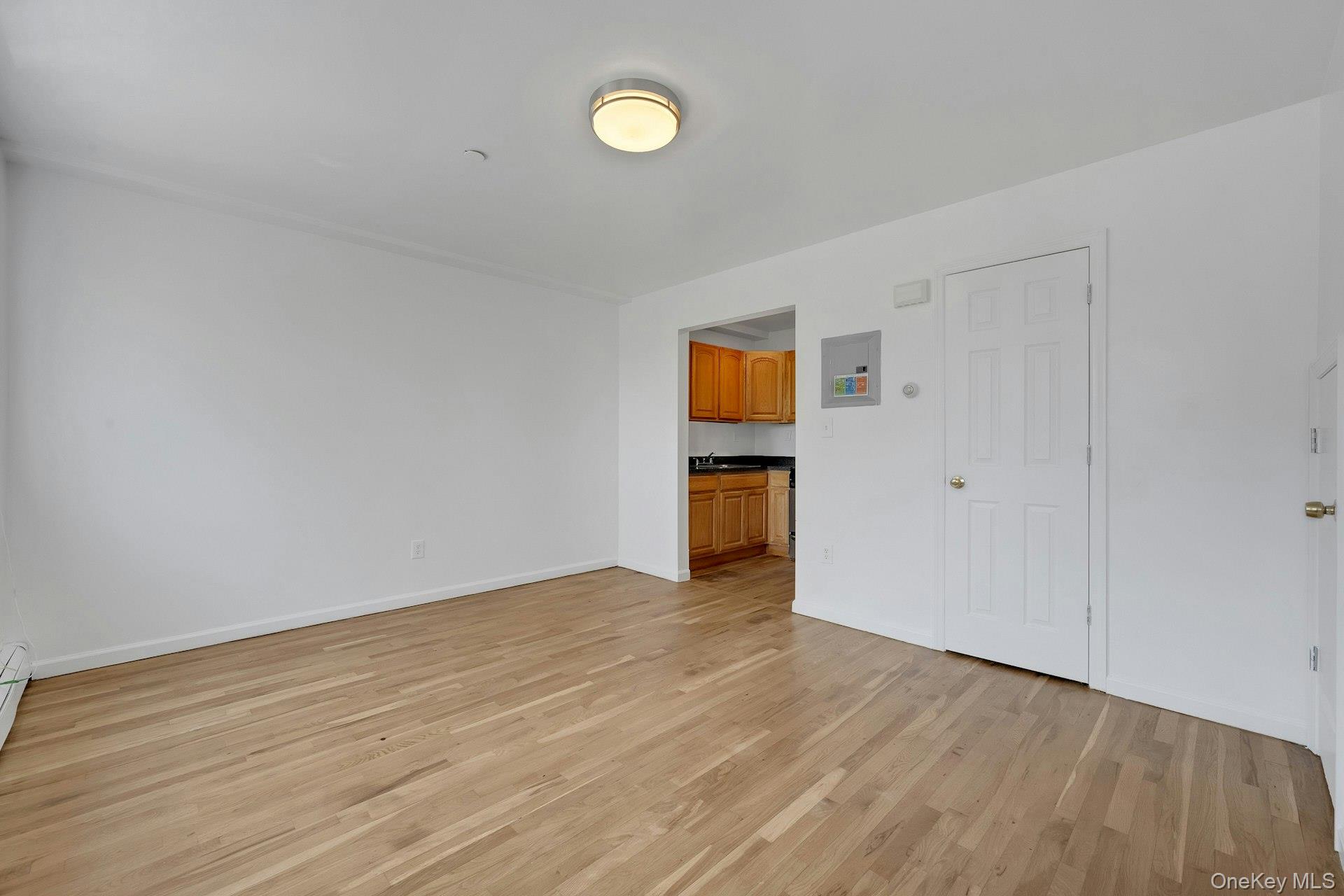 3313 Rombouts Avenue Bronx, NY 10475 - Photo 35 of 44 a view of empty room with wooden floor