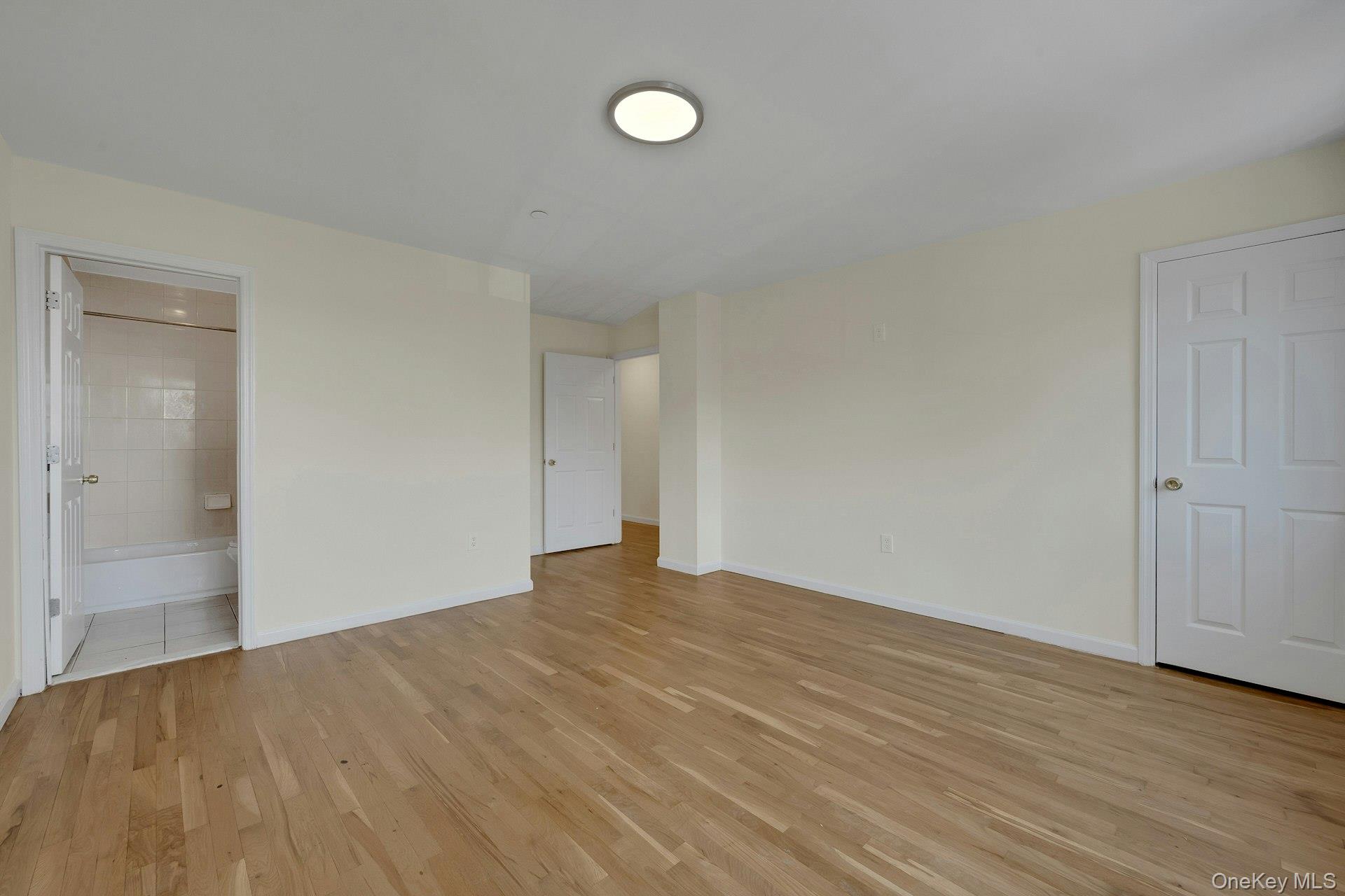 3313 Rombouts Avenue Bronx, NY 10475 - Photo 38 of 44 a view of an empty room with wooden floor
