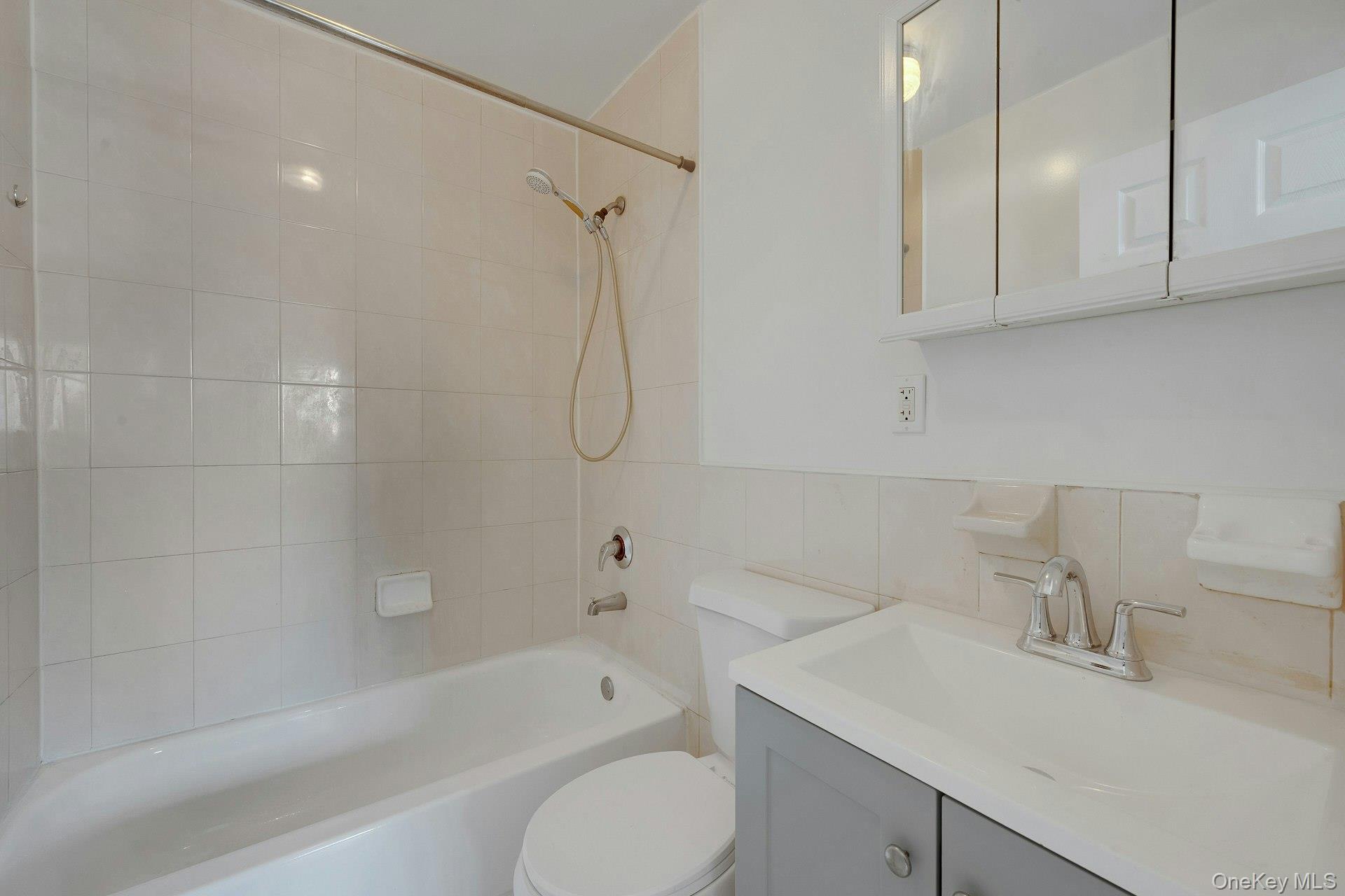 3313 Rombouts Avenue Bronx, NY 10475 - Photo 39 of 44 a bathroom with a sink toilet and shower