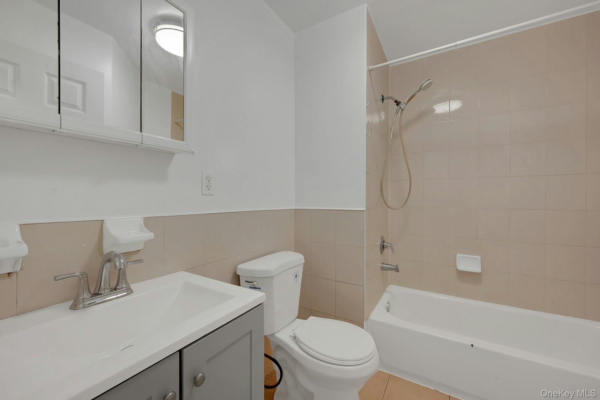 3313 Rombouts Avenue Bronx, NY 10475 - Photo 44 of 44 a bathroom with a sink a toilet and shower