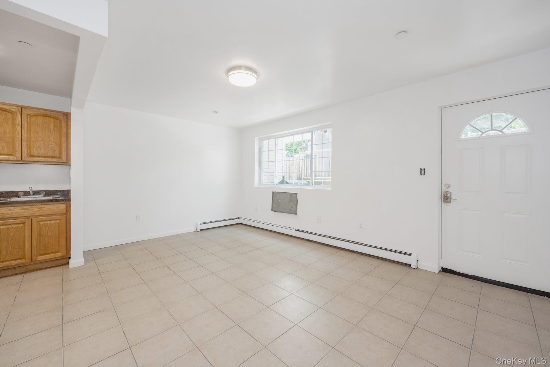 3313 Rombouts Avenue Bronx, NY 10475 - Photo 6 of 44 an empty room with windows