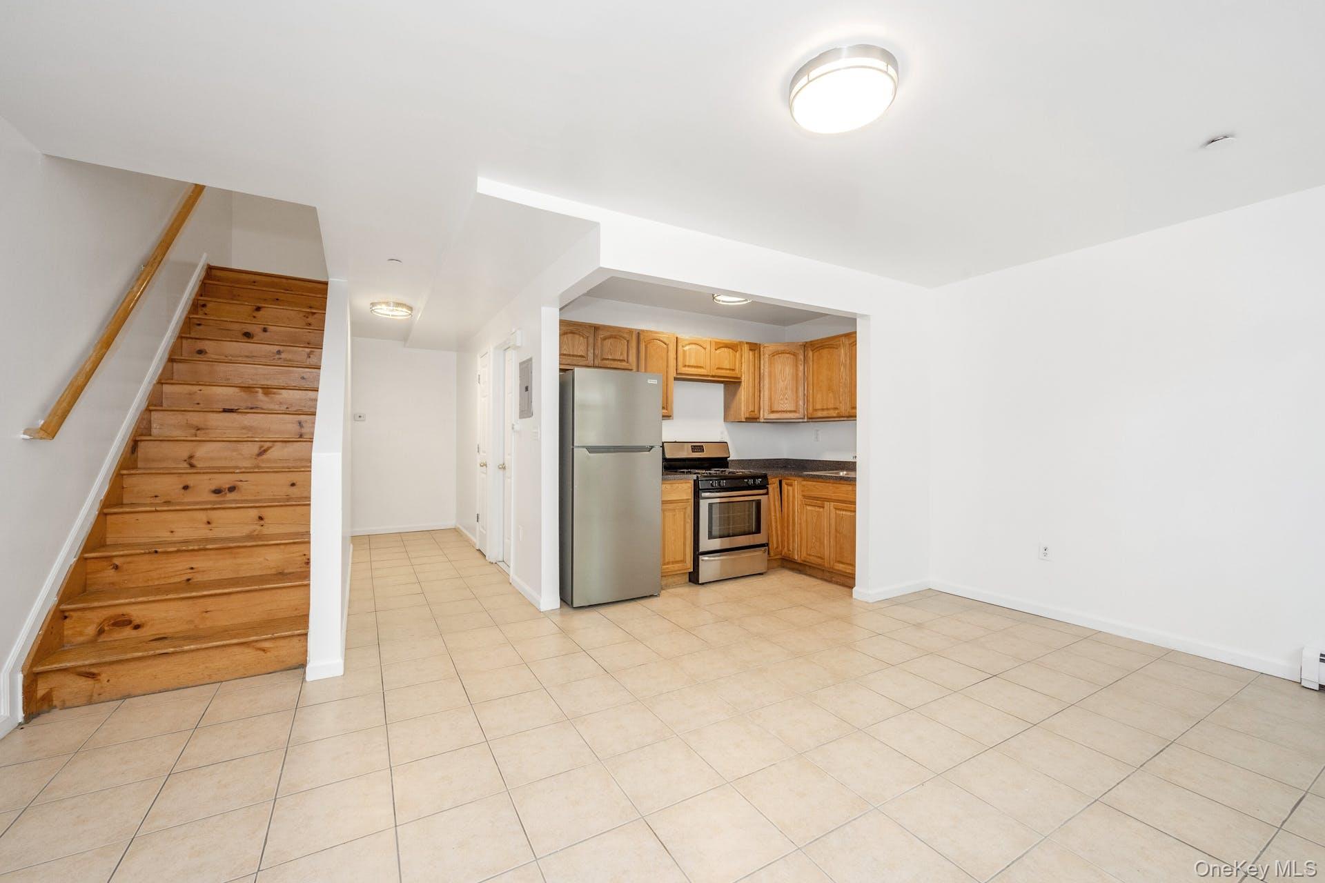 3313 Rombouts Avenue Bronx, NY 10475 - Photo 9 of 44 a view of kitchen with cabinets and wooden floor