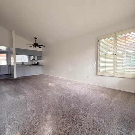 a view of a room with window and cabinet
