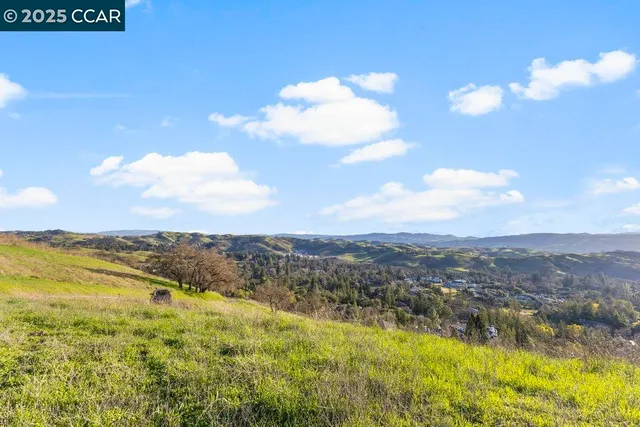 a view of an ocean and a mountain