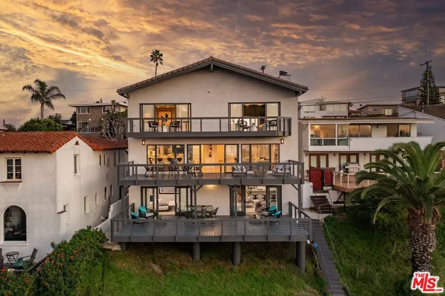 a aerial view of a house with swimming pool