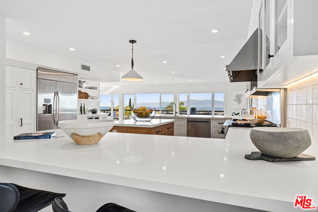 249 Rees Street Playa del Rey, CA 90293 - Photo 13 of 37 a kitchen with stainless steel appliances lots of counter top space