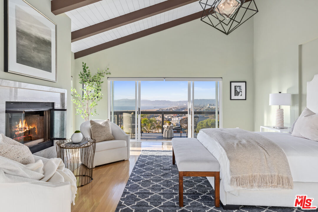249 Rees Street Playa del Rey, CA 90293 - Photo 24 of 37 a bedroom with furniture and a fireplace