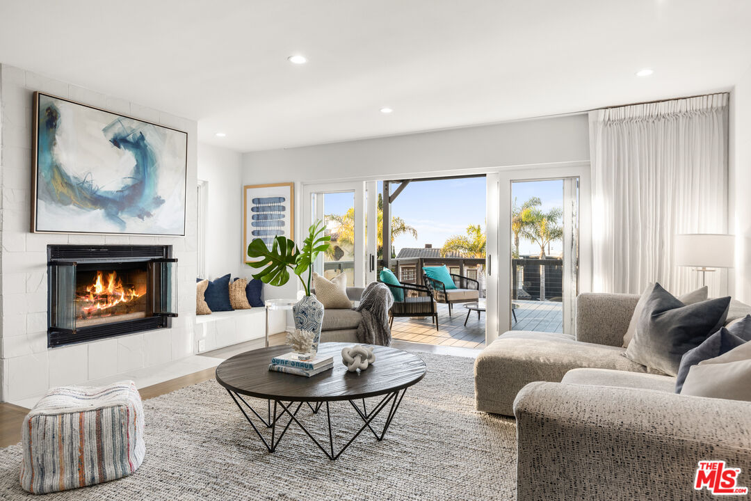 249 Rees Street Playa del Rey, CA 90293 - Photo 26 of 37 a living room with furniture and a fireplace
