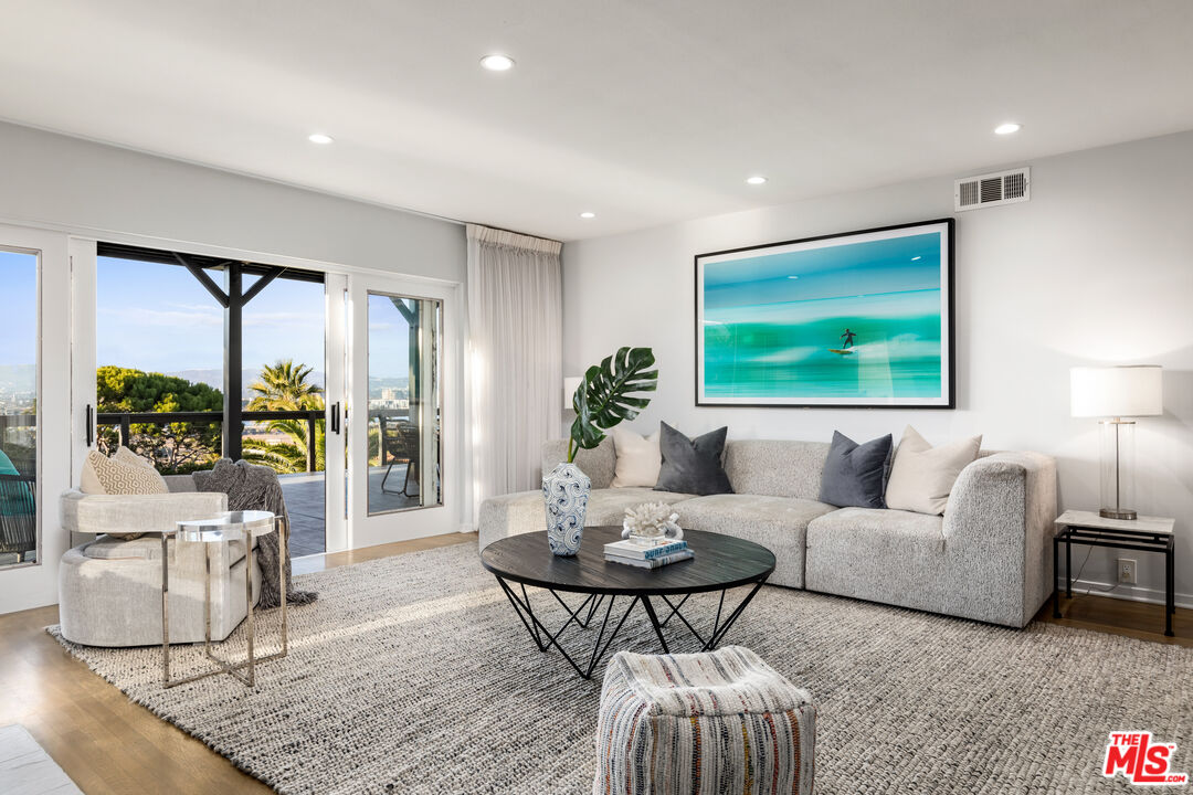 249 Rees Street Playa del Rey, CA 90293 - Photo 27 of 37 a living room with furniture and a flat screen tv