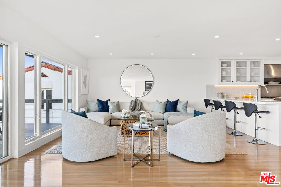 249 Rees Street Playa del Rey, CA 90293 - Photo 5 of 37 a living room with fireplace furniture and a large window