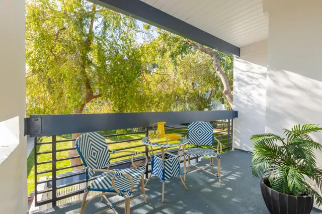 a view of a balcony with chairs