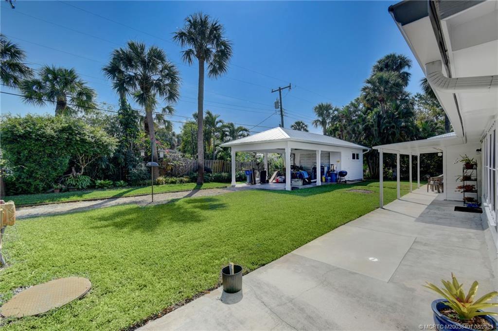 834 Southeast Riverside Drive Stuart, FL 34994 - Photo 30 of 35 a view of a house with a yard