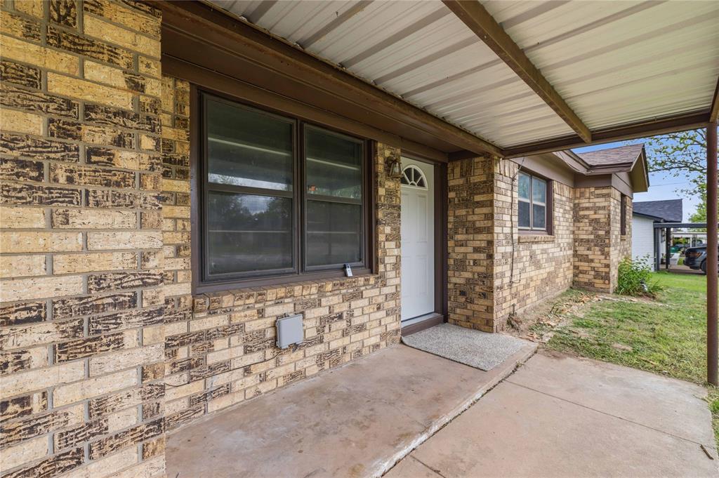 900 West 2nd Street Coleman, TX 76834 - Photo 18 of 28 a front view of a house with a yard