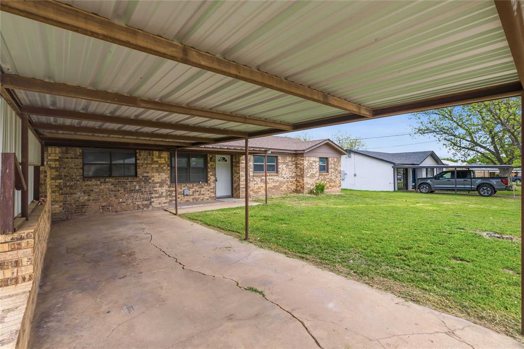 900 West 2nd Street Coleman, TX 76834 - Photo 20 of 28 a view of a house with a patio