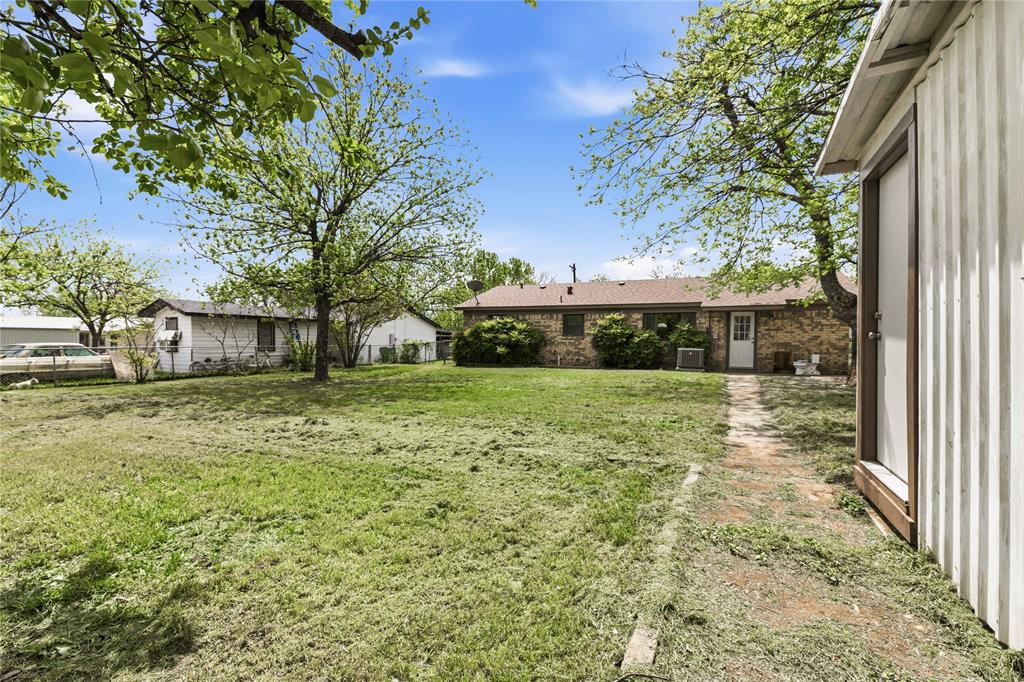 900 West 2nd Street Coleman, TX 76834 - Photo 25 of 28 a view of a house with a yard