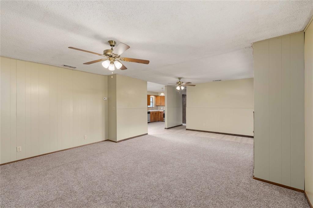 900 West 2nd Street Coleman, TX 76834 - Photo 6 of 28 a view of a livingroom with a ceiling fan and chandelier fan
